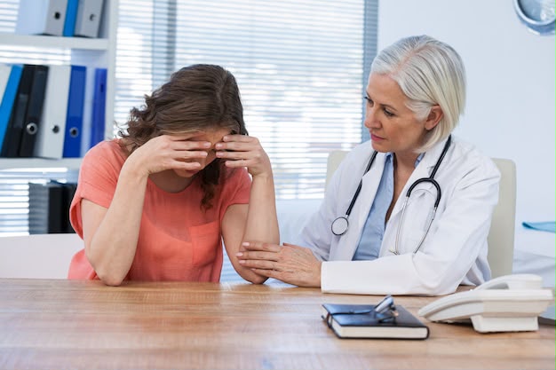 Caring psychiatrist comforting a patient during a confidential mental health consultation at Realize De-Addiction Centre